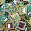 A bin full of retired CPUs from old laptops or computers.