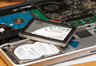 An SSD placed on top of an HDD, which can now be recycled for REEs.