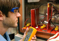 Researcher testing lithium-ion batteries for next-gen battery tech.