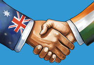 Shaking hands with sleeves representing Australian and Indian flags.