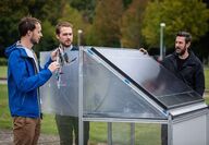 The Solhyd team standing around a solar hydrogen prototype cell.