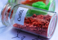 A vial of red powder labeled CoSO4, the symbol for cobalt sulfate.