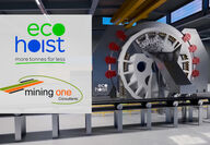 Rendering of large wheel dumping ore buckets with Mining One, EcoHoist logos.