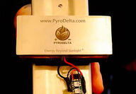 A gold-colored rectangular device engraved with the PyroDelta logo.