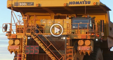 Komatsu autonomous haul truck hauling iron ore at a Rio Tinto mine in Australia.