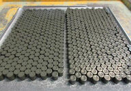 Rows of cylindrical LEU+ fuel pellets at Westinghouse’s Springfield facility.