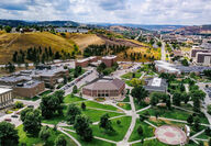 Aerial view of a college campus near South Dakota’s Black Hills and Badlands.